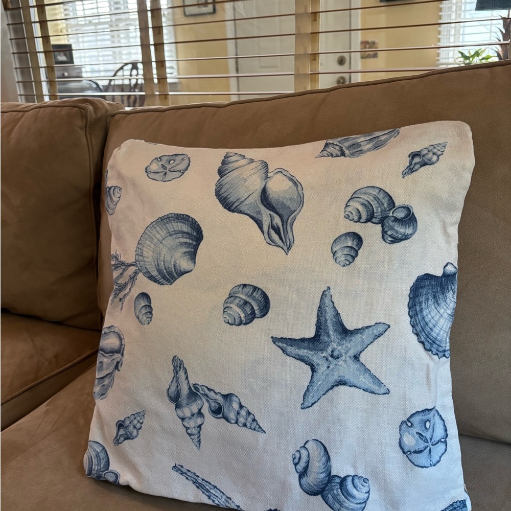 Blue and White Coastal Accent Pillow with Seashell Design